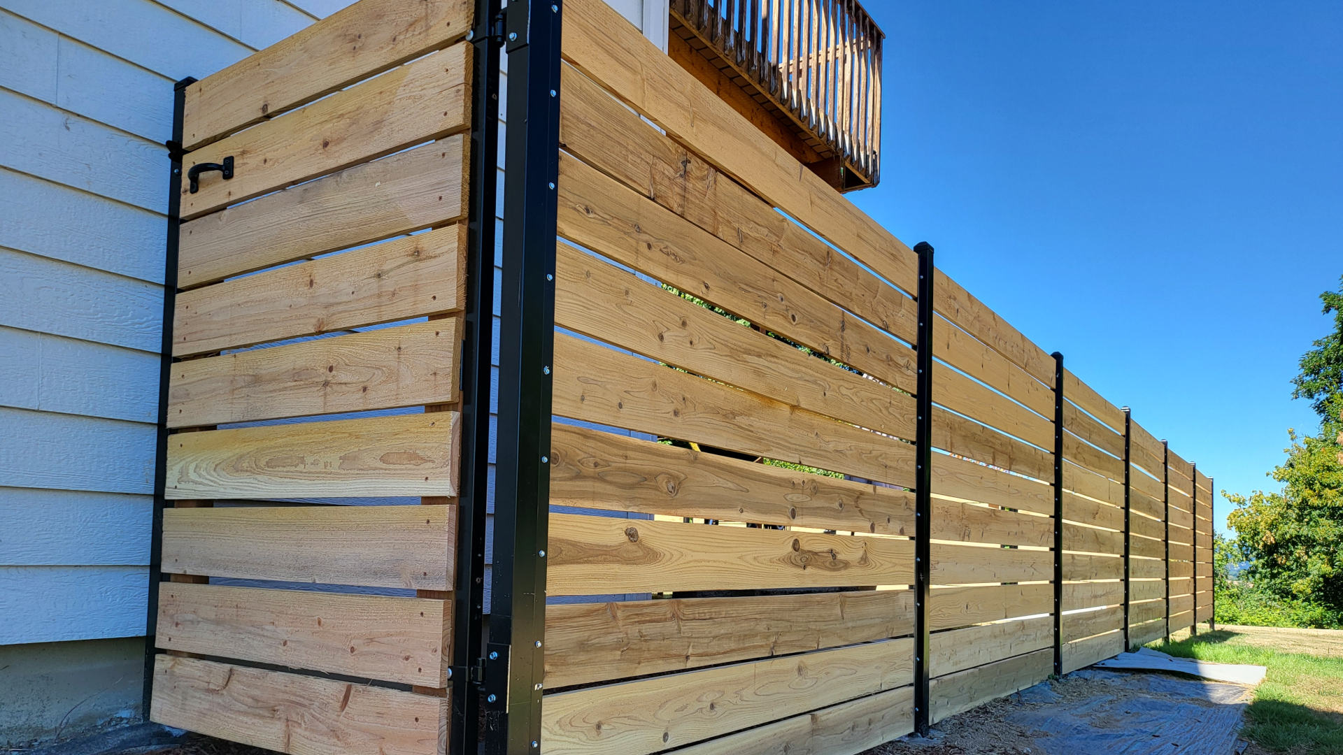 Completed ornamental iron fence and gate at a Portland home